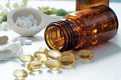 vitamins Vitamins presented on a white table.